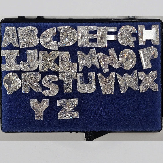 Matched pair of Alphabets lab grown diamonds, E VS1, 31.21ct total