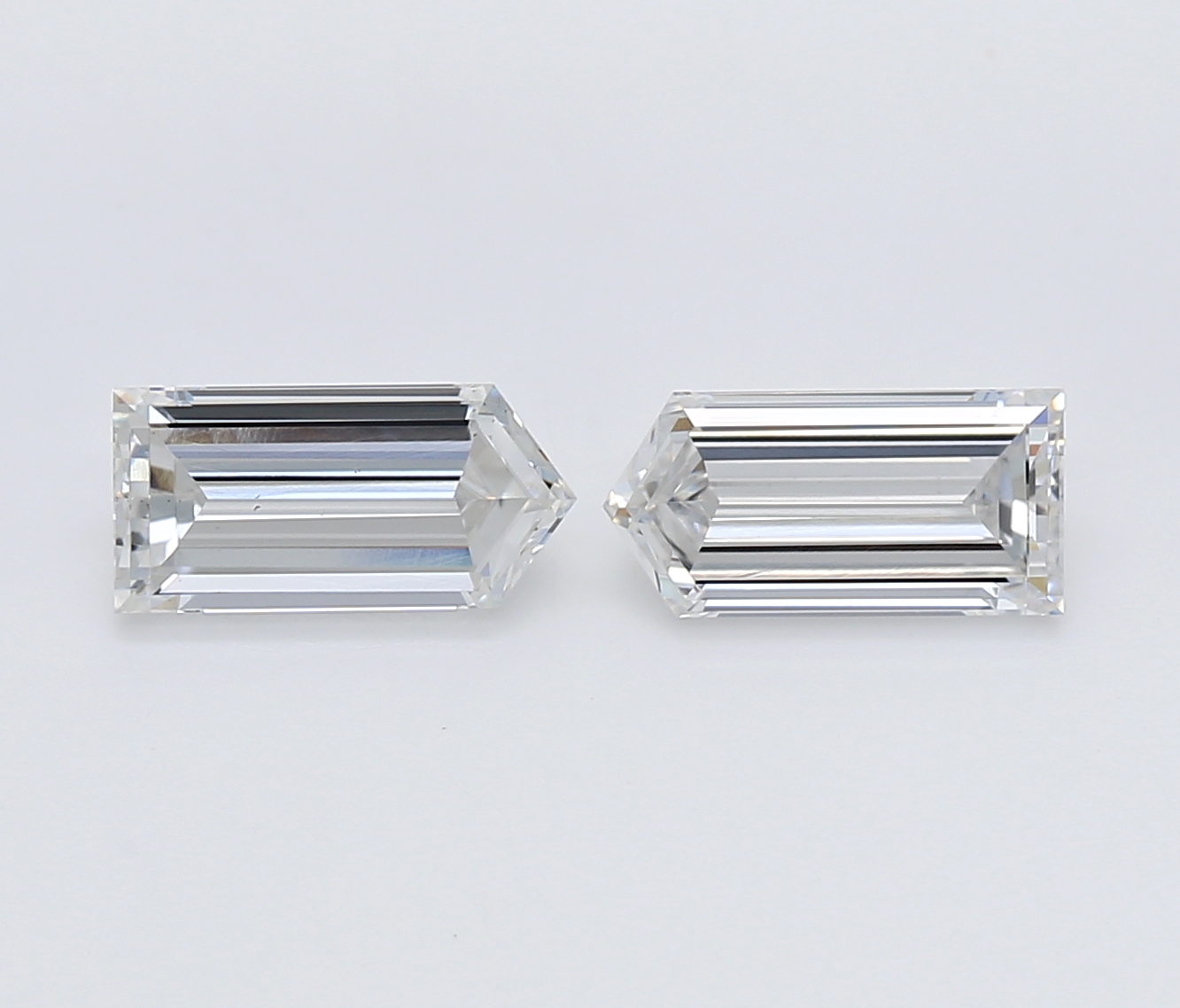 Matched pair of Bullet lab grown diamonds, 5.70 × 2.80 mm, E VVS2, 0.55ct total